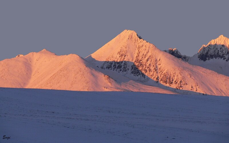 snowy mountains at sunrise
