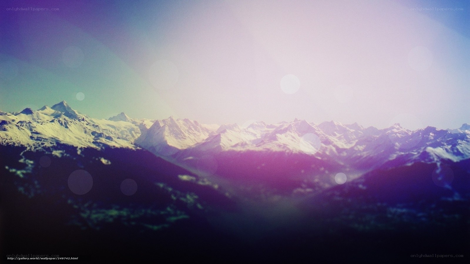 snowy mountains at sunrise