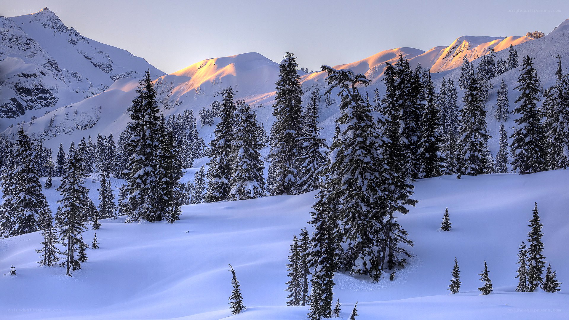 Snowy mountains at sunrise