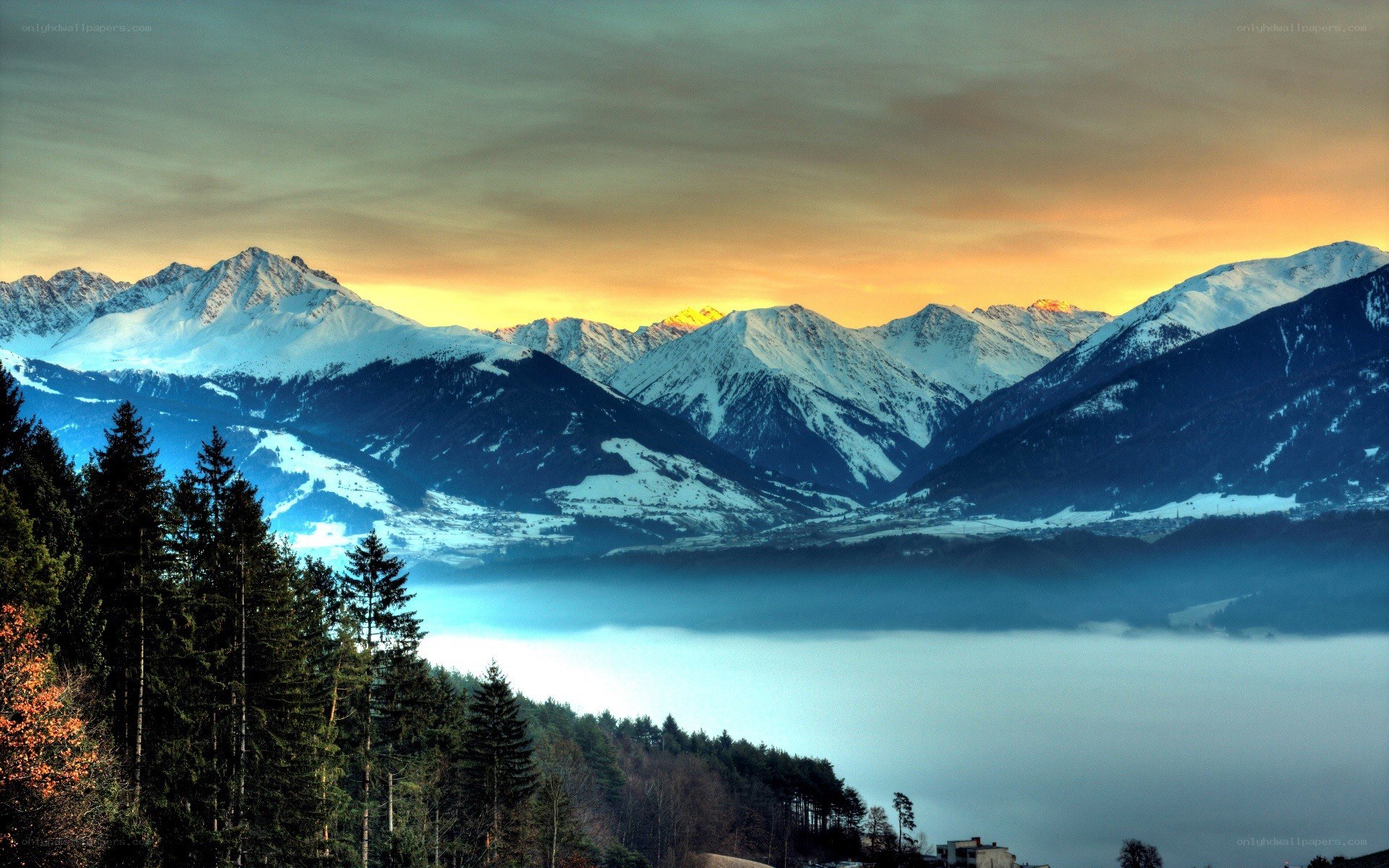 Snowy mountains at sunset