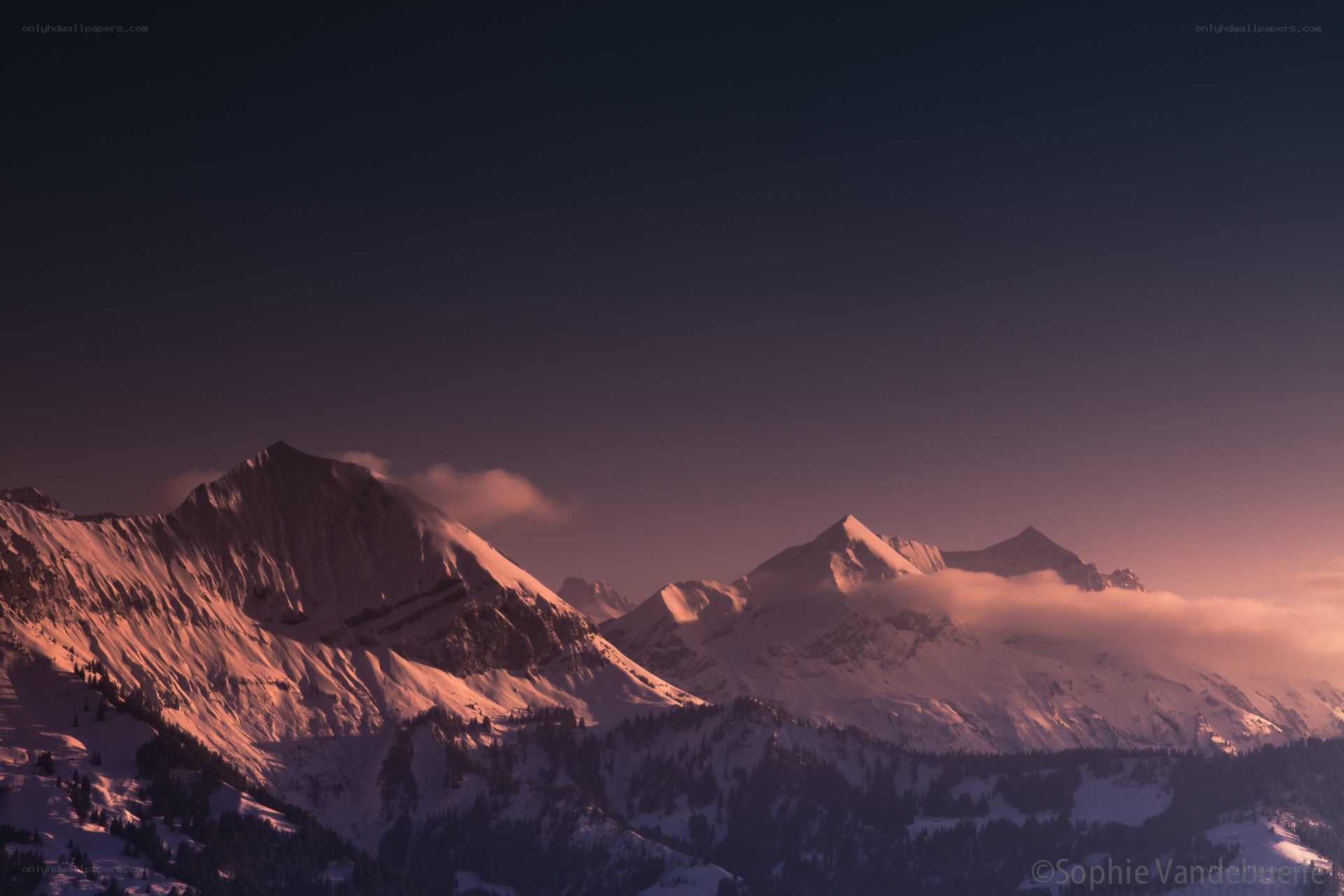 Snowy mountains at sunset
