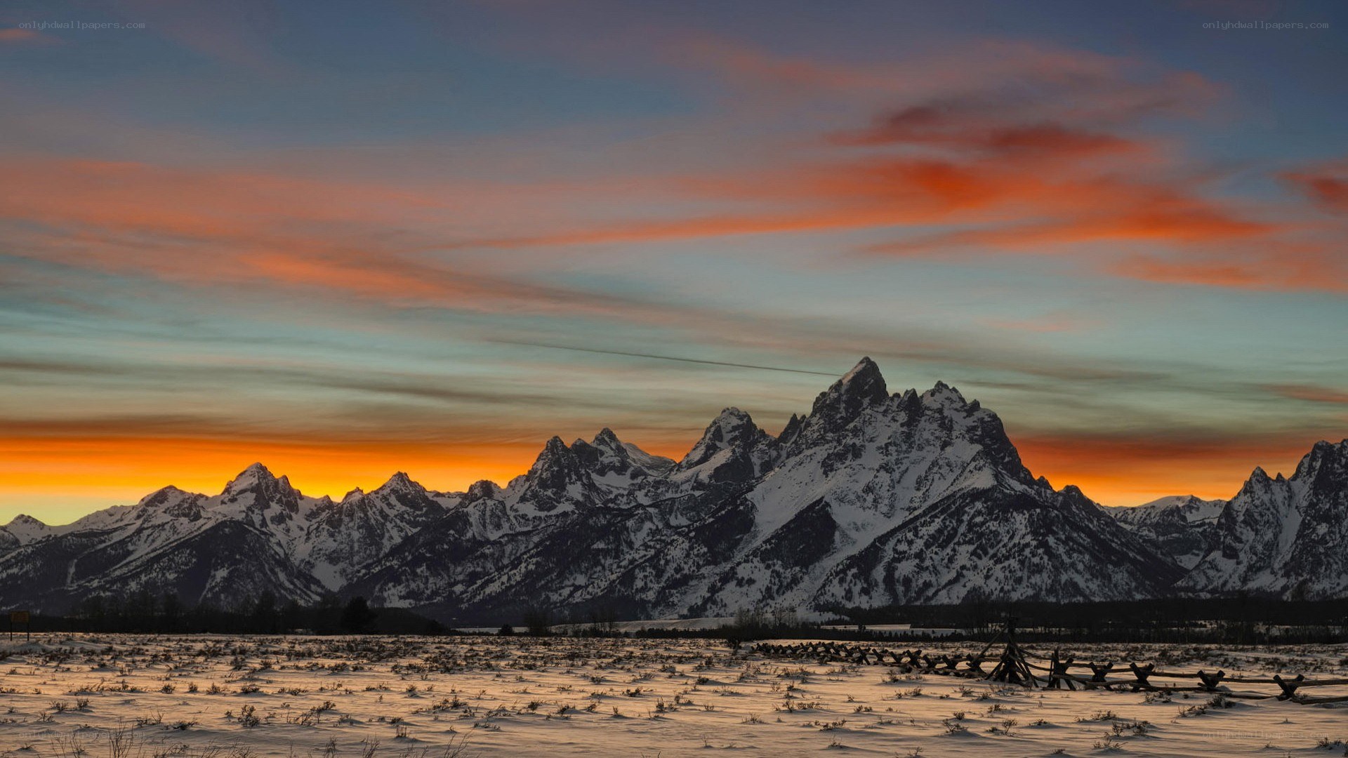 Snowy mountains at sunset