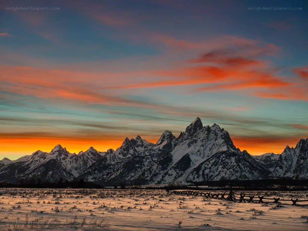Snowy mountains at sunset