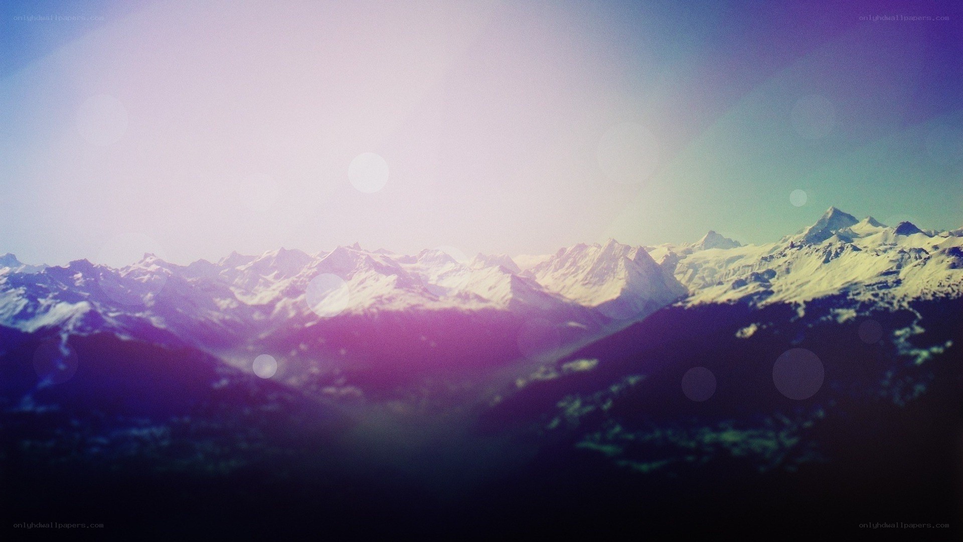 snowy mountains at sunset