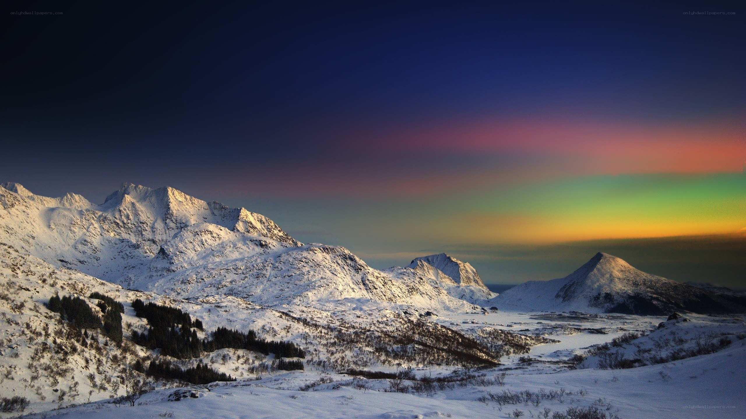 Snowy mountains at sunset