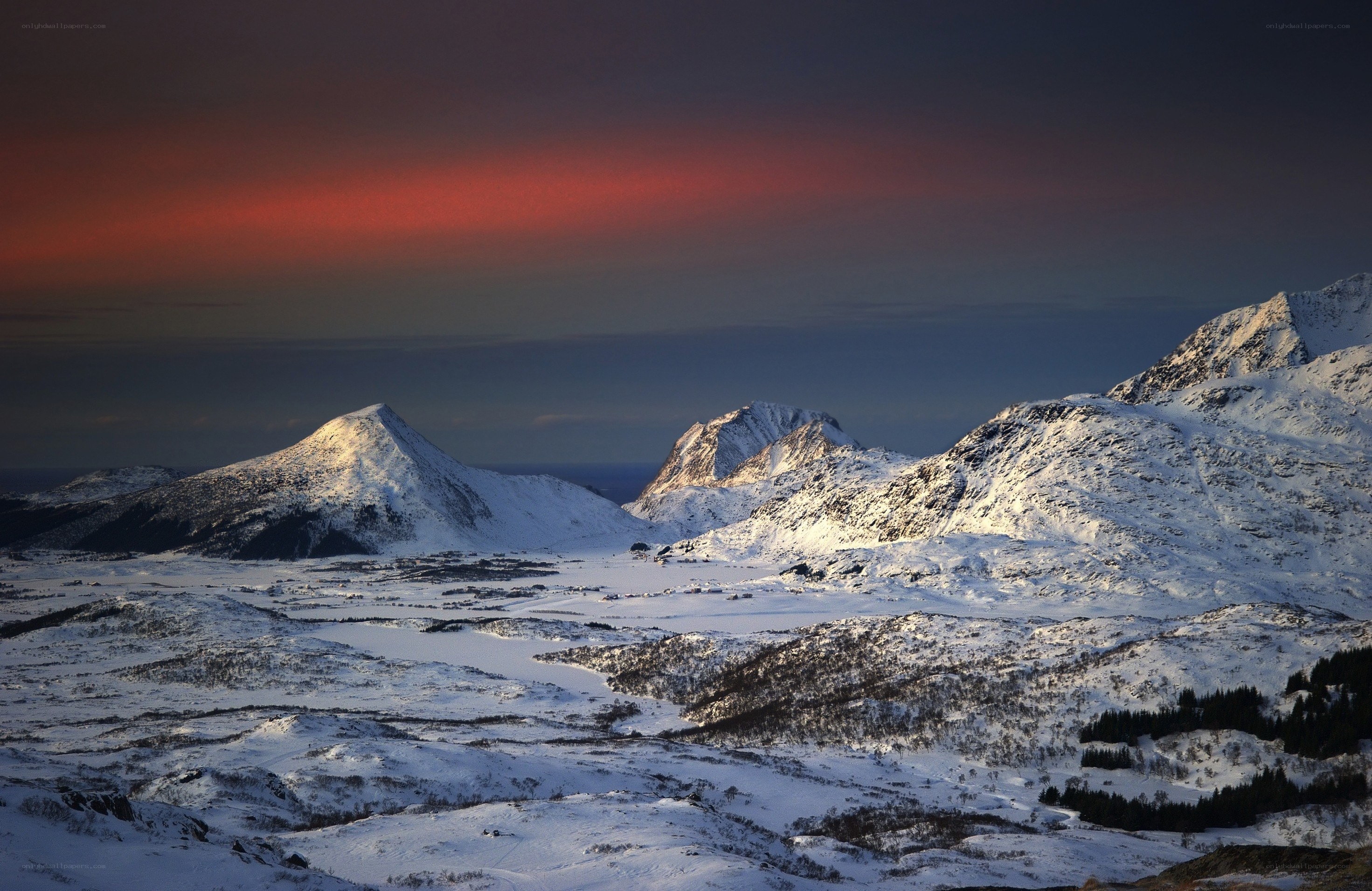 Snowy mountains at sunset