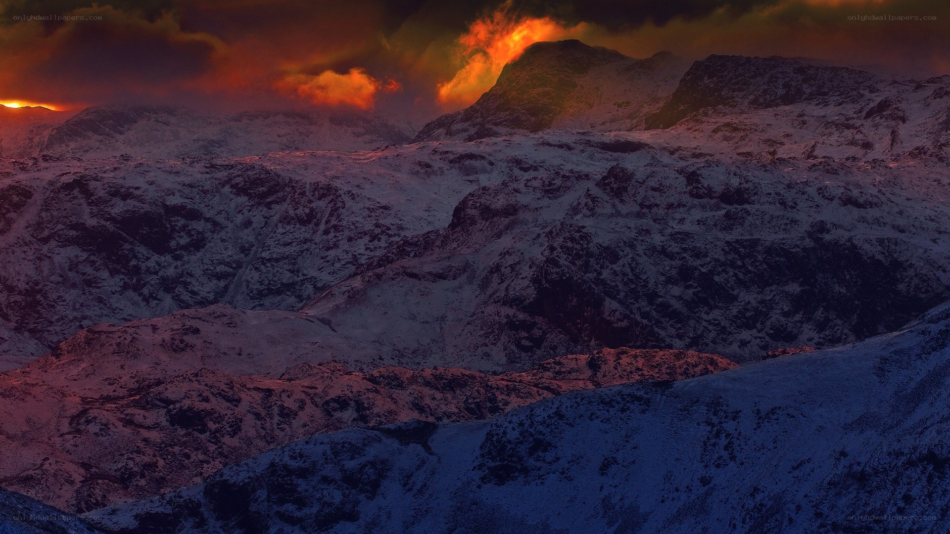 Snowy mountains at sunset