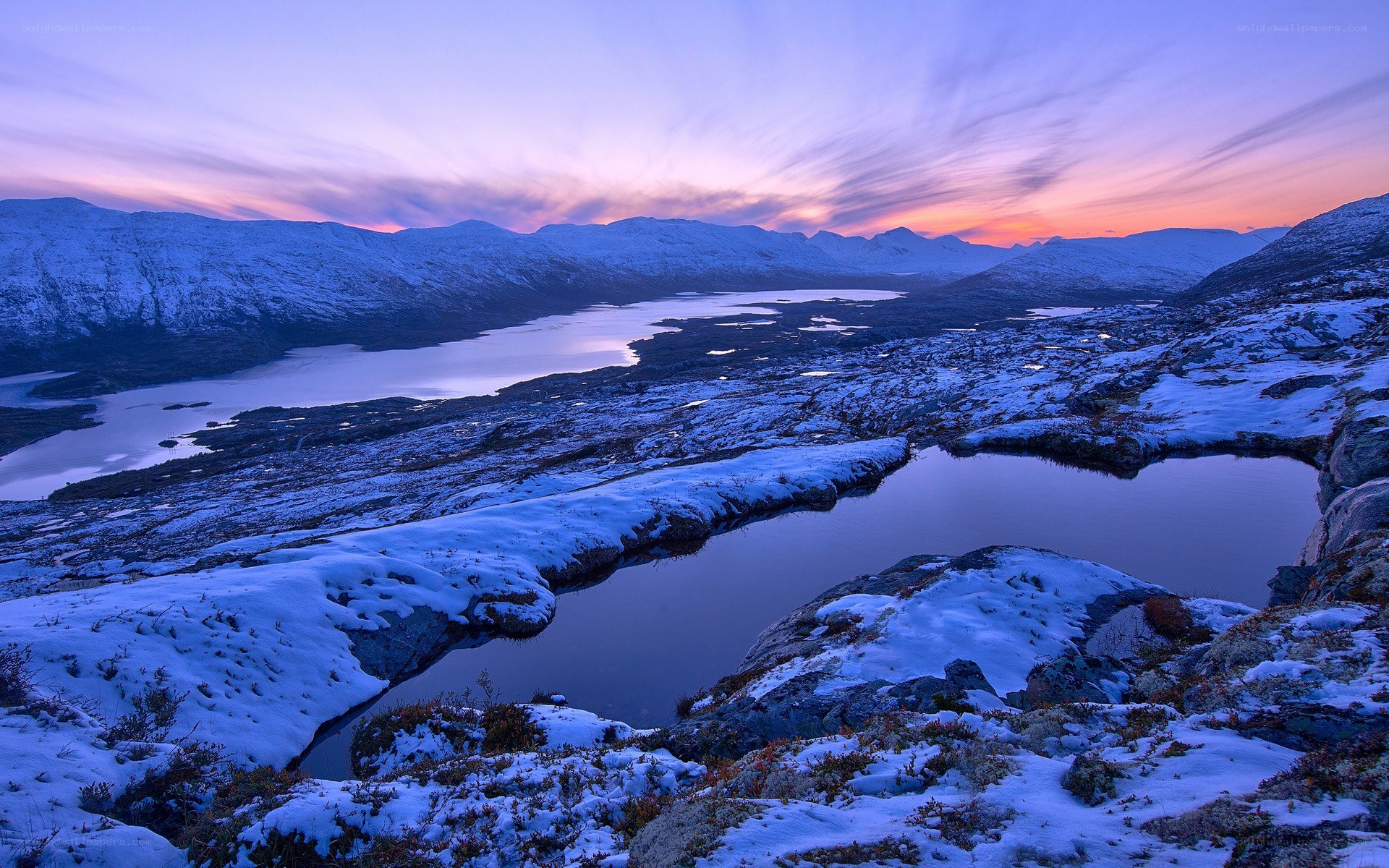 Snowy mountains at sunset