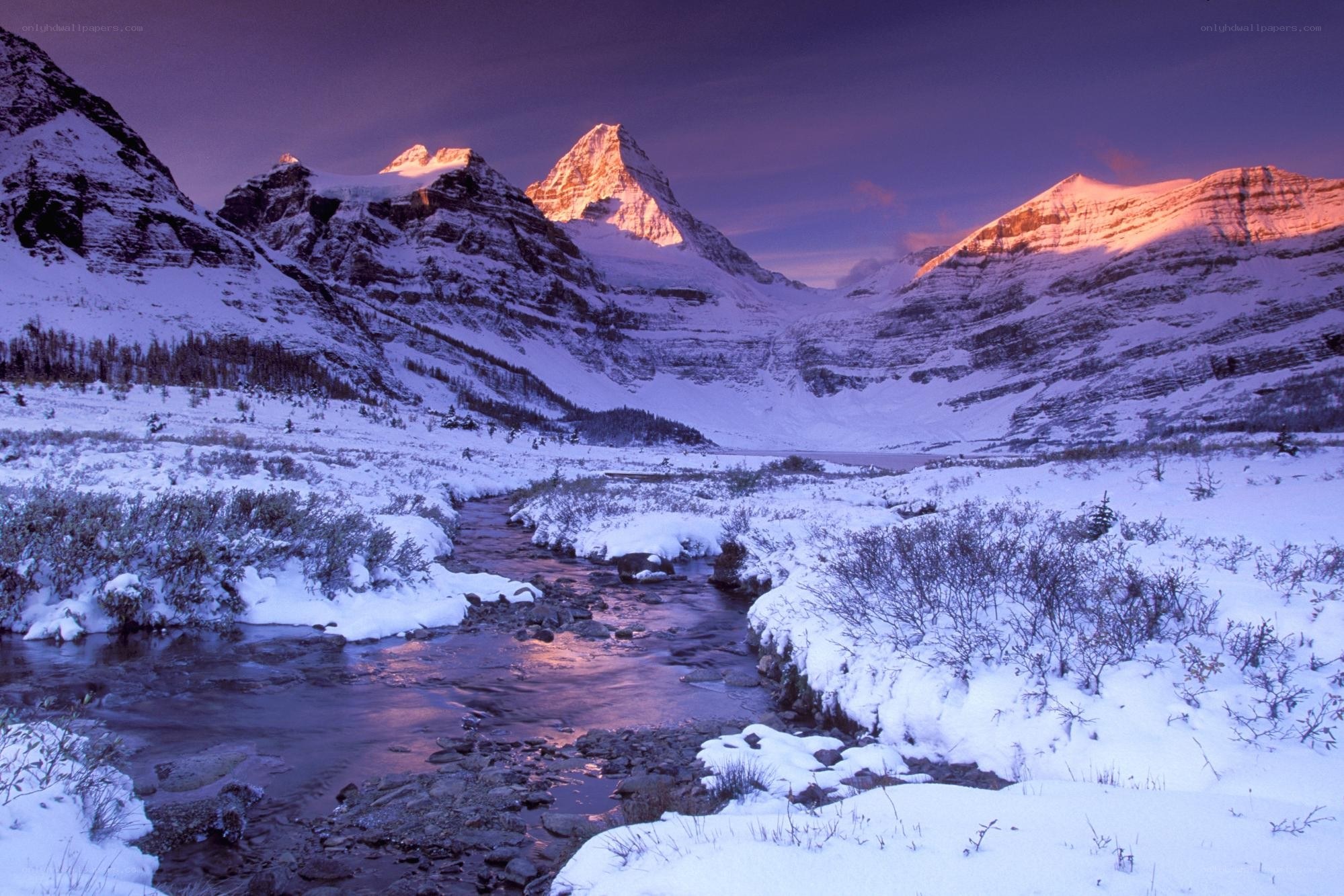 Snowy mountains at sunset