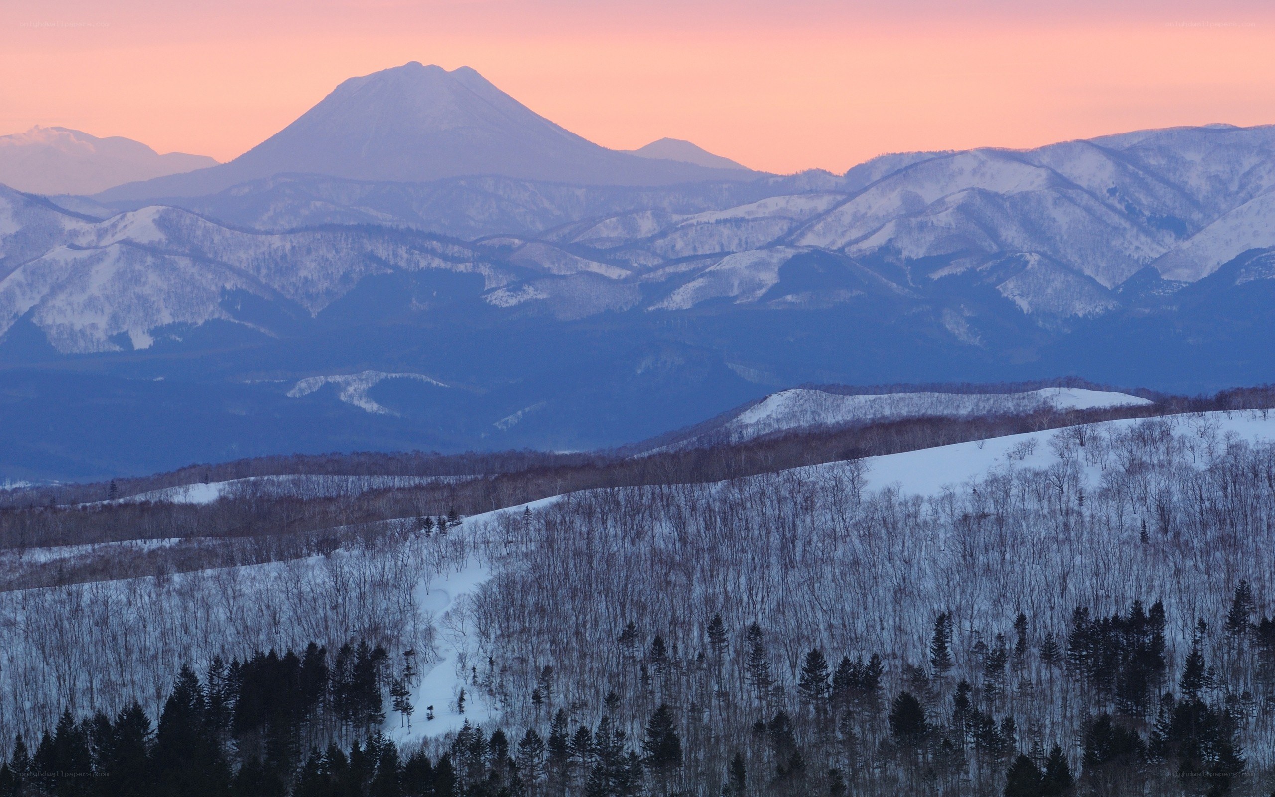 Snowy mountains at sunset