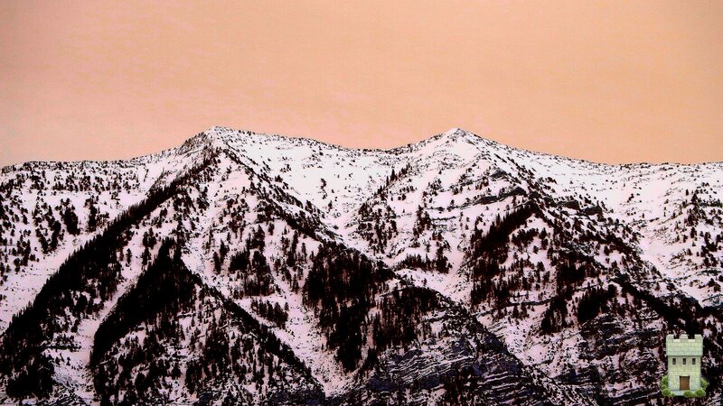snowy mountains at sunset