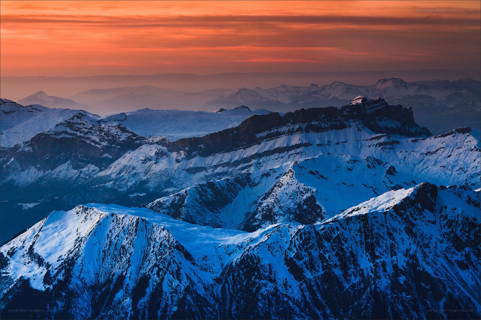 Snowy mountains at sunset