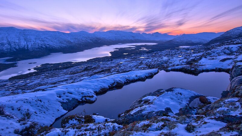 Snowy mountains at sunset