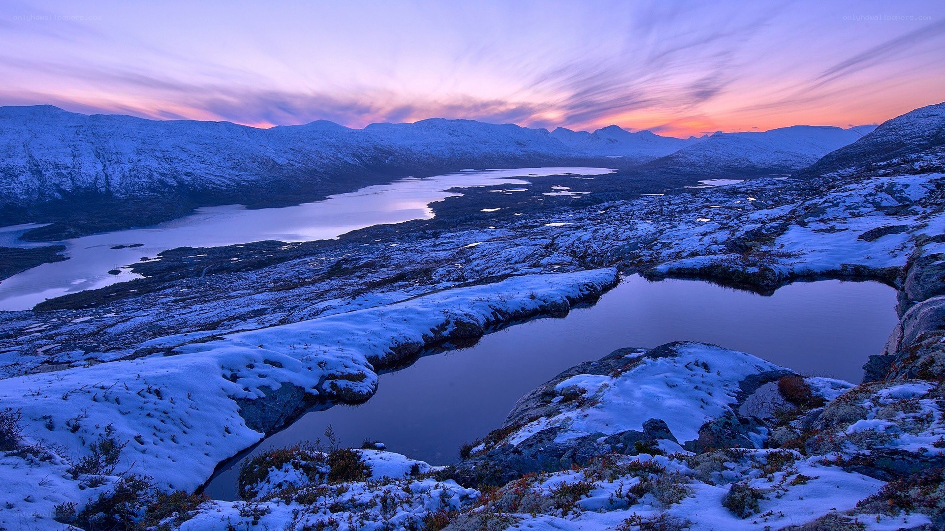 Snowy mountains at sunset
