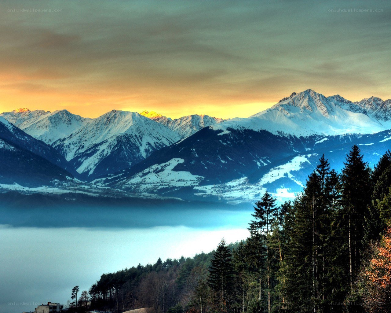 Snowy mountains at sunset