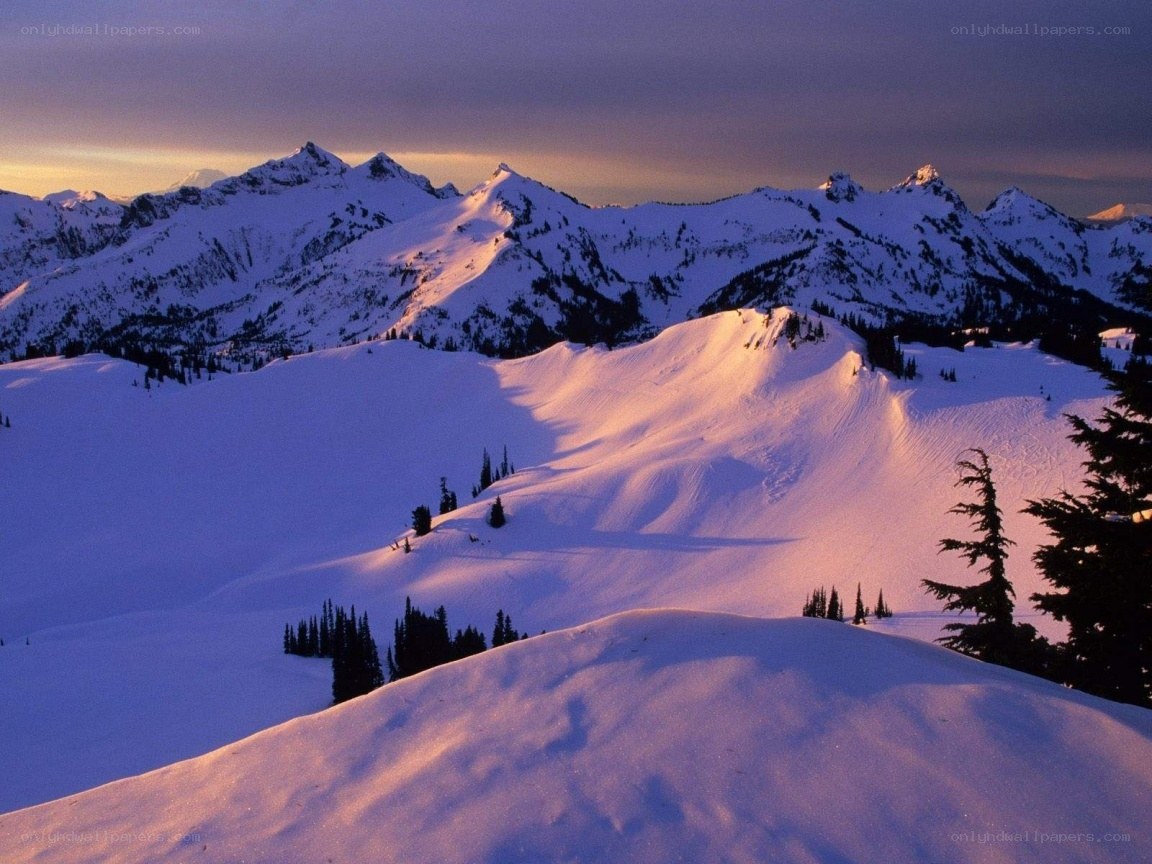 snowy mountains at sunset
