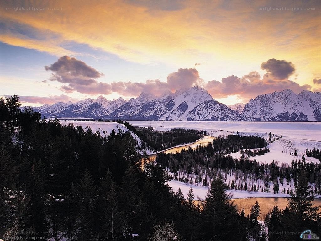 snowy mountains at sunset