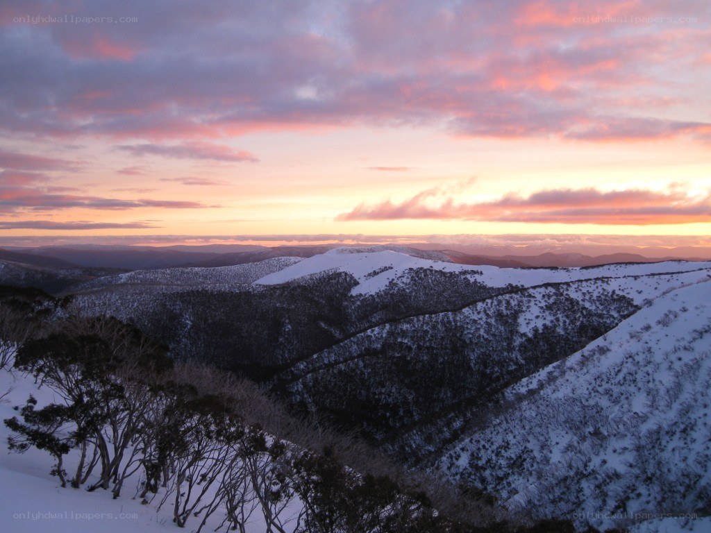 Snowy mountains at sunset