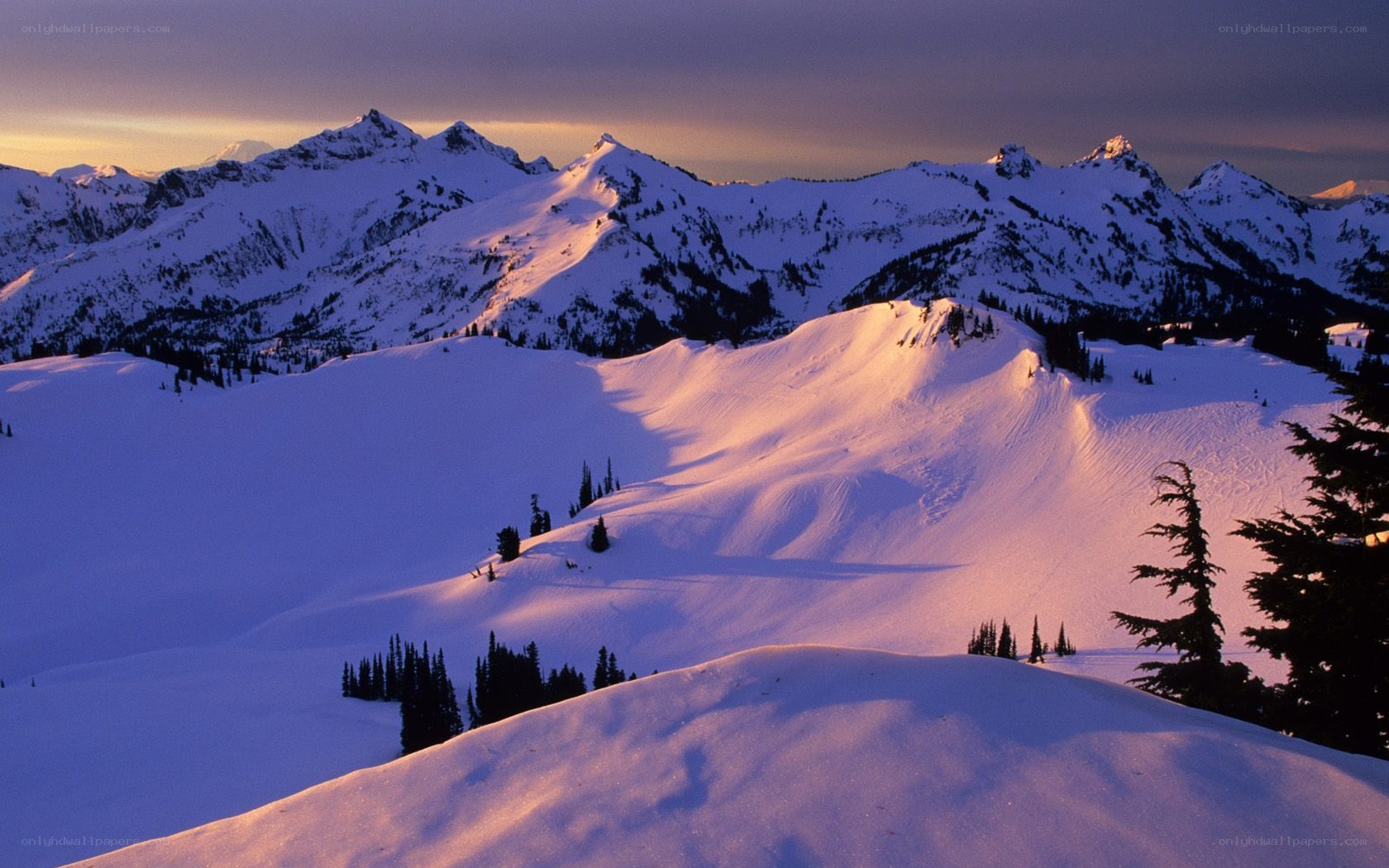 snowy mountains at sunset