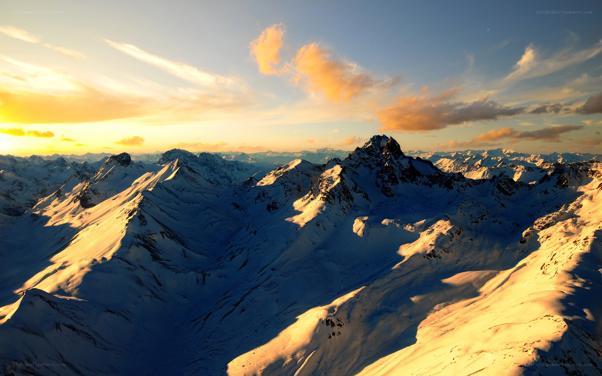 Snowy mountains at sunset