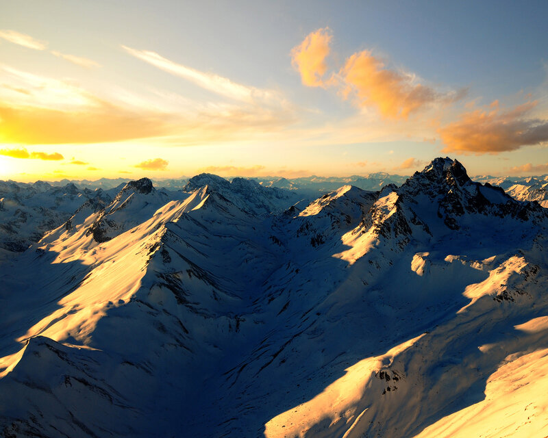 Snowy mountains at sunset