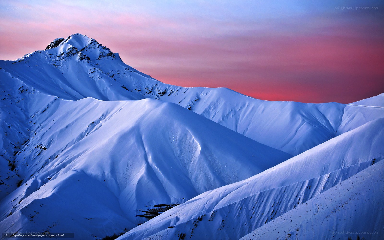 Snowy mountains at sunset