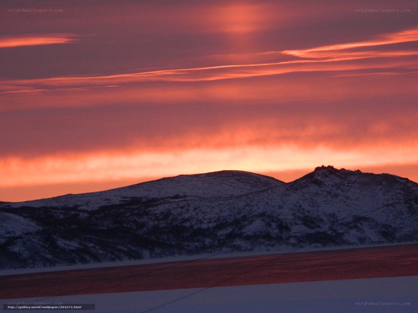 Snowy mountains at sunset
