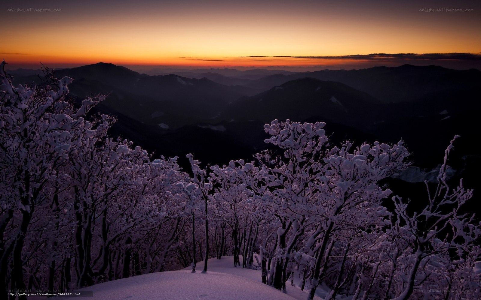 Snowy mountains at sunset