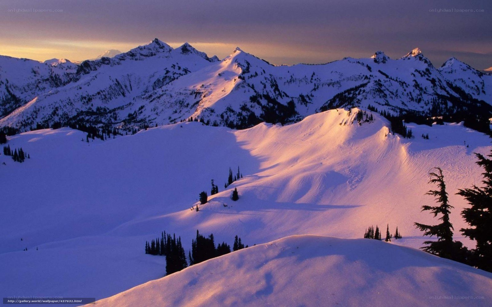 snowy mountains at sunset