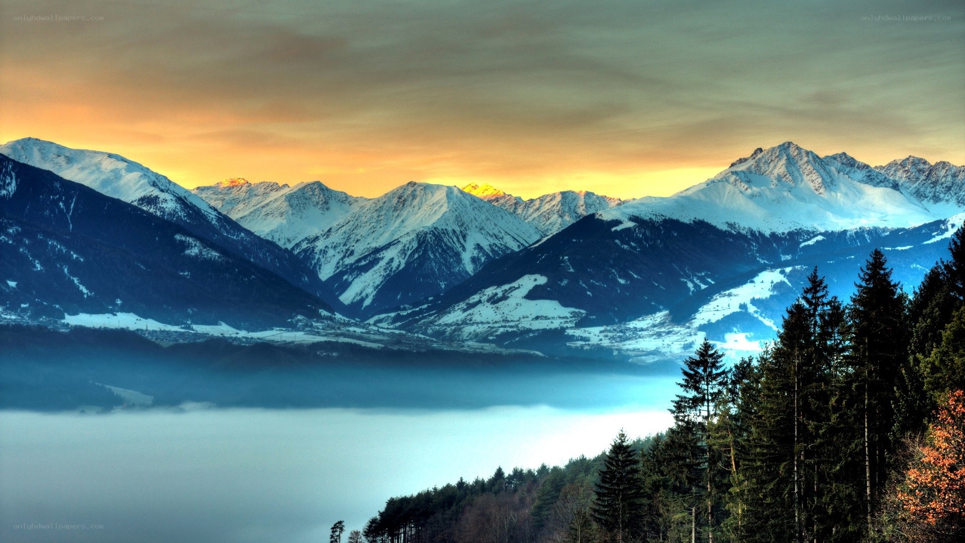 snowy mountains at sunset