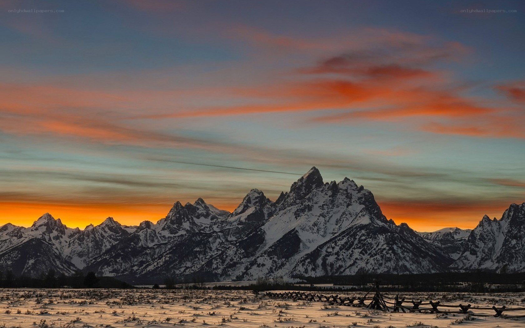 Snowy mountains at sunset
