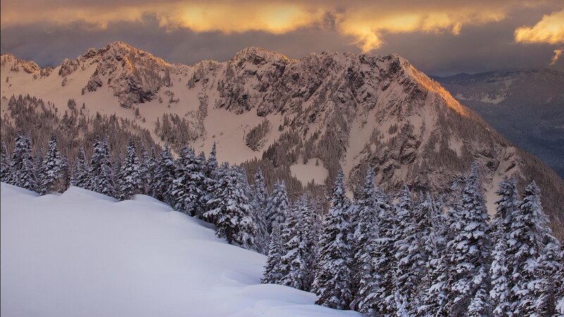 Snowy mountains at sunset