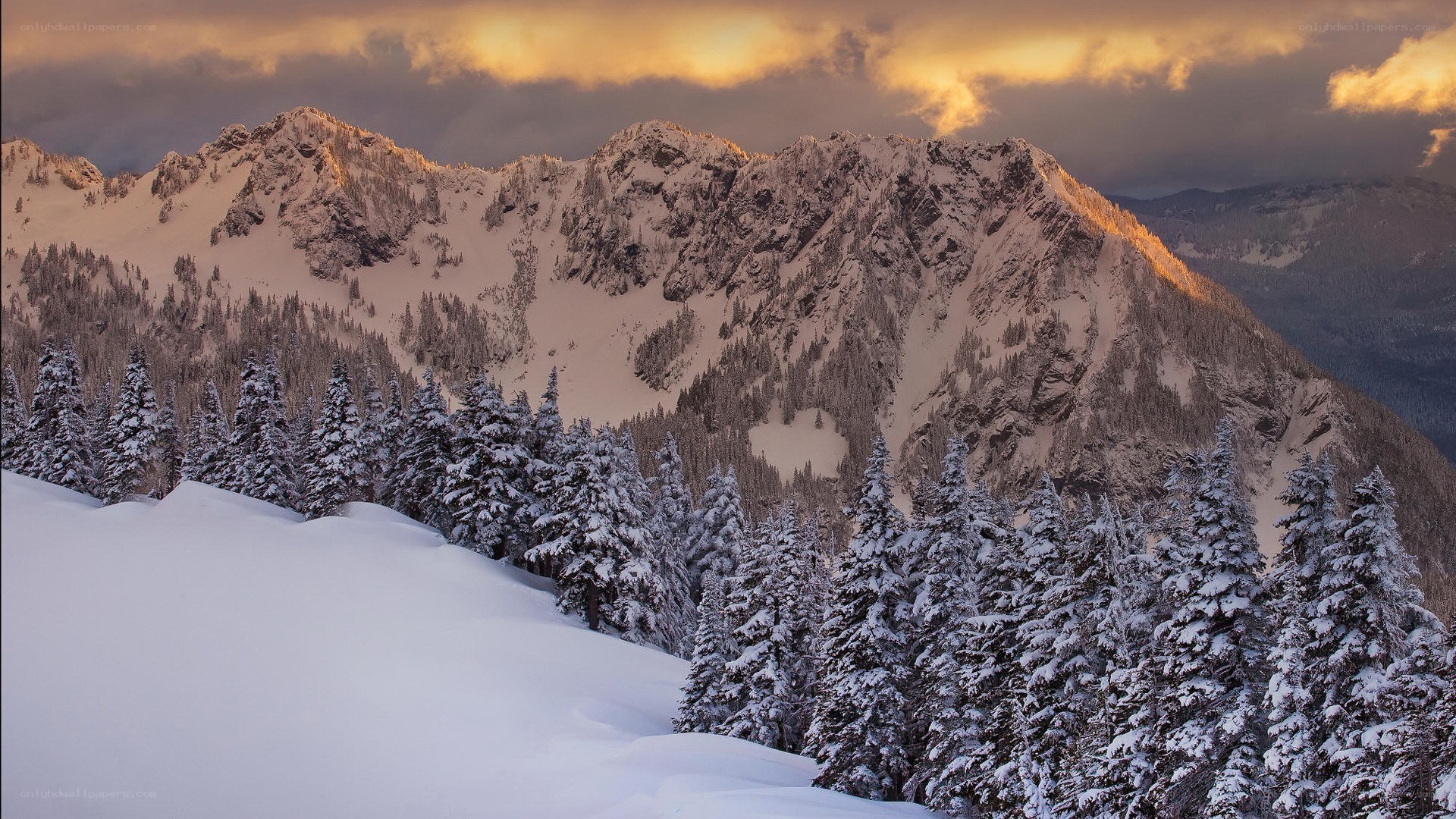 Snowy mountains at sunset