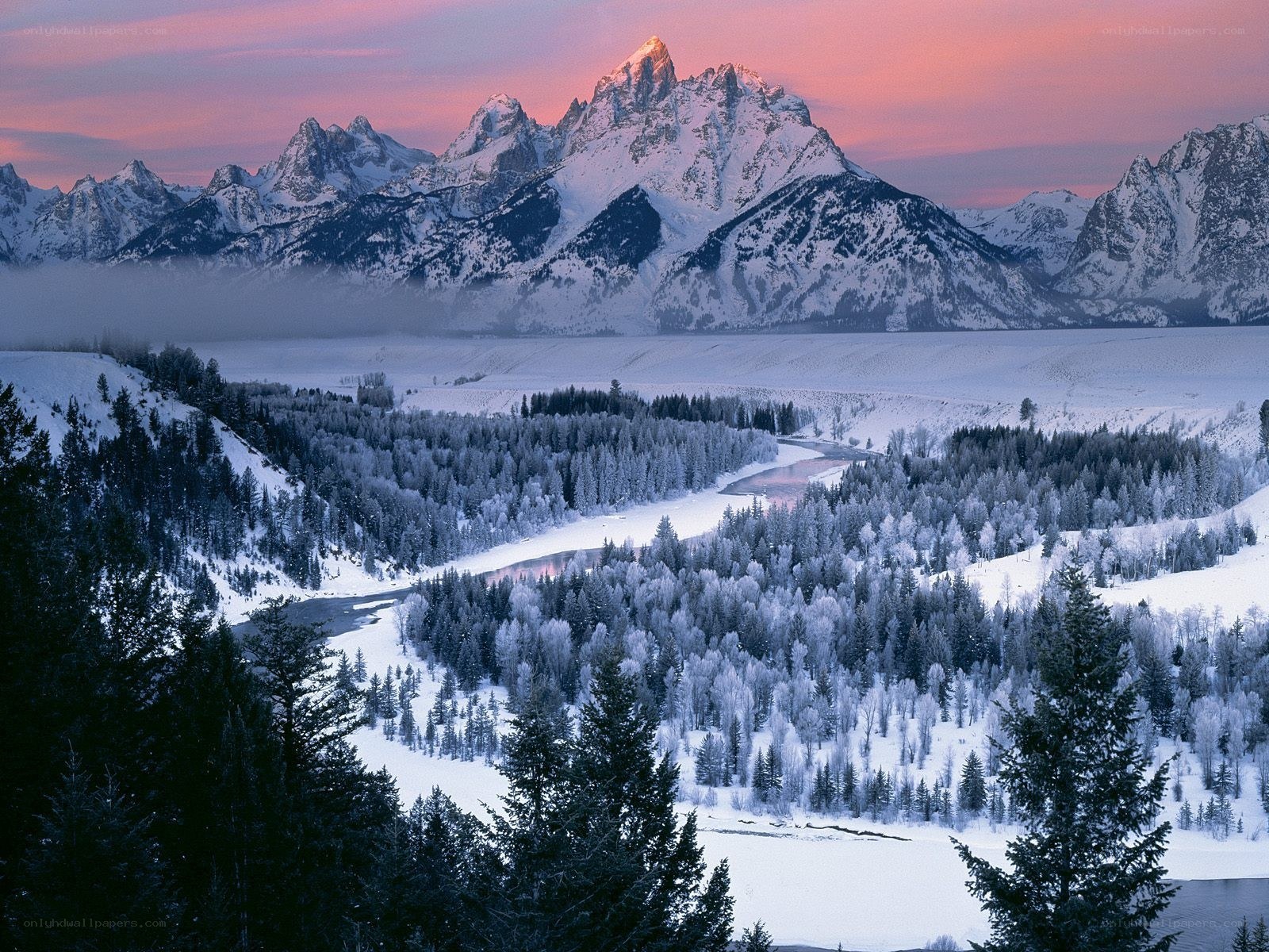 Snowy mountains at sunset