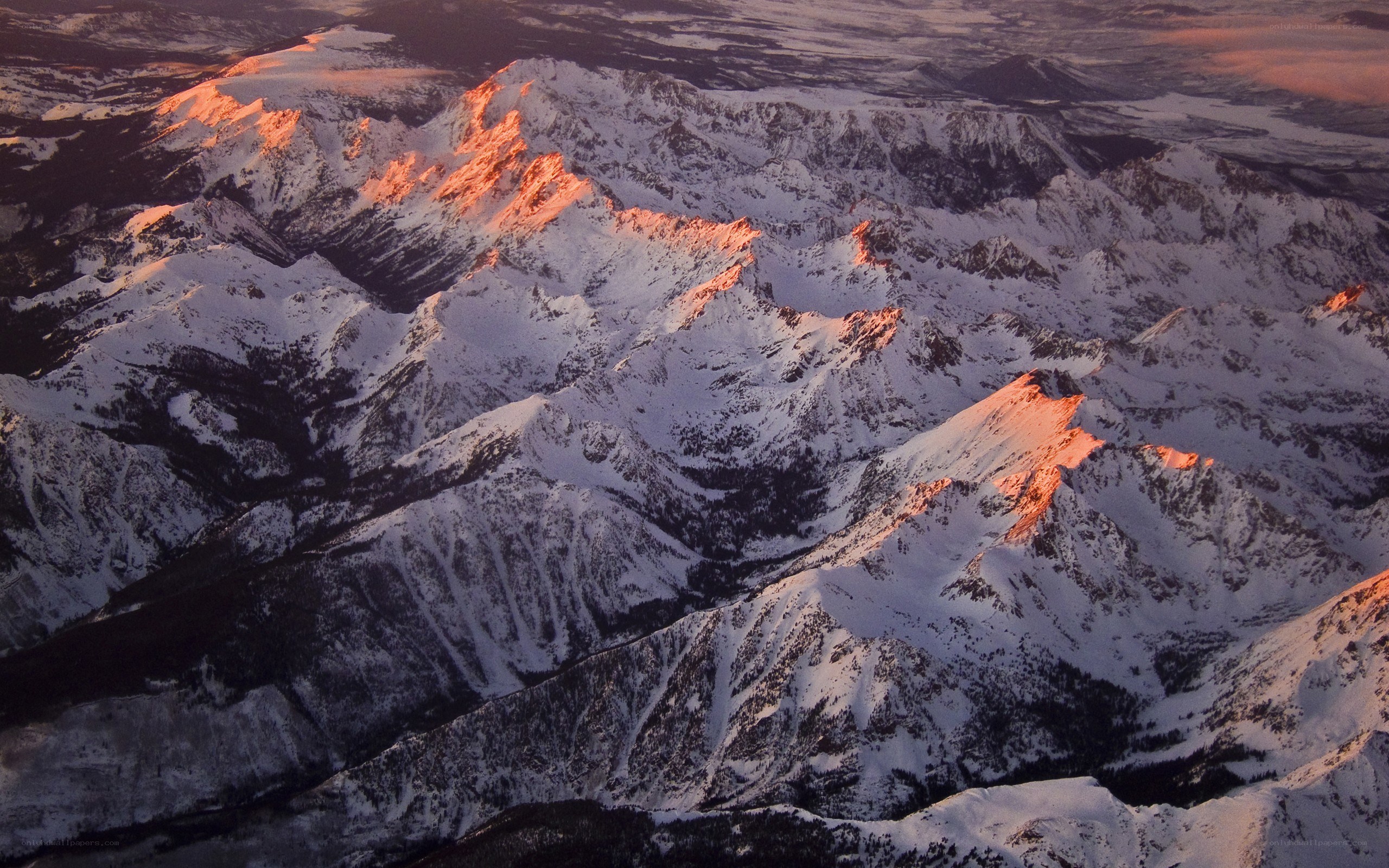 snowy mountains at sunset