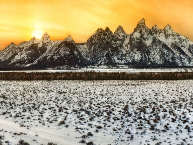 Snowy mountains at sunset