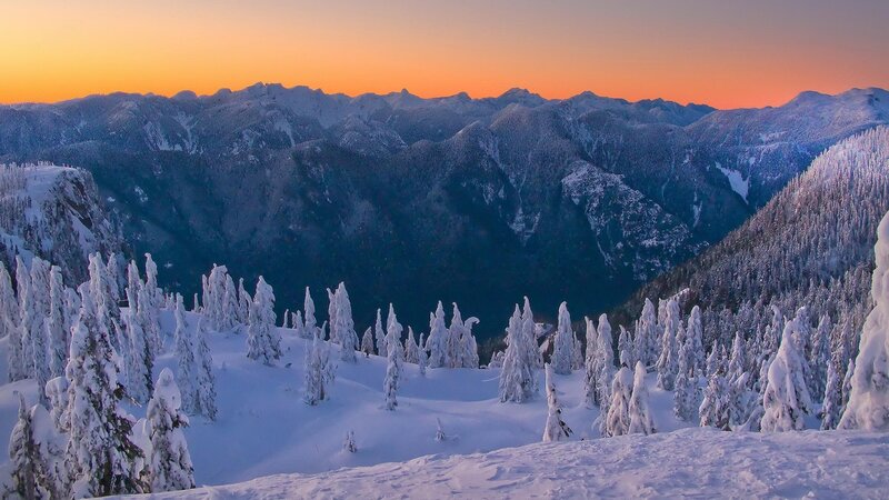 Snowy mountains at sunset