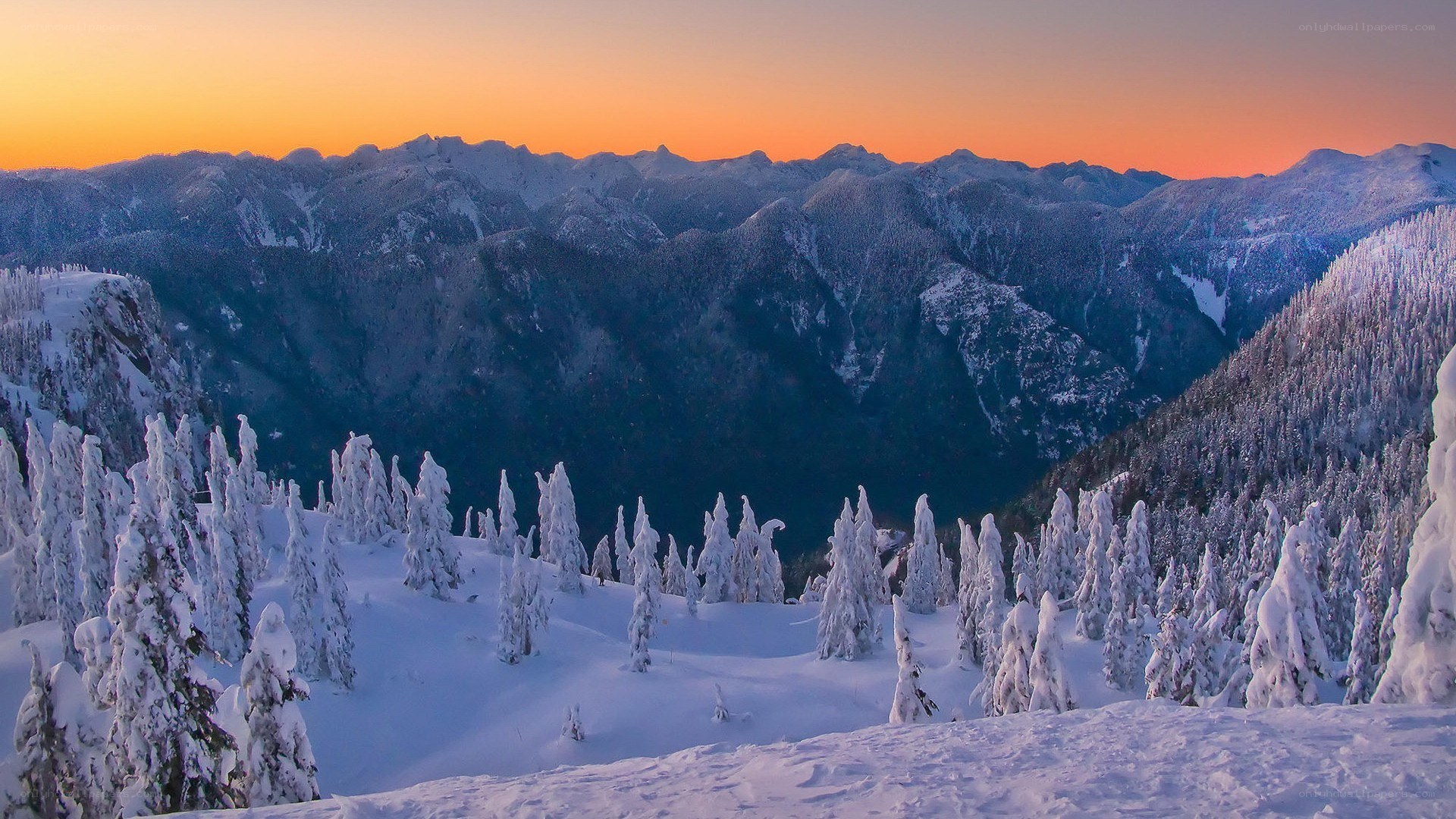 Snowy mountains at sunset