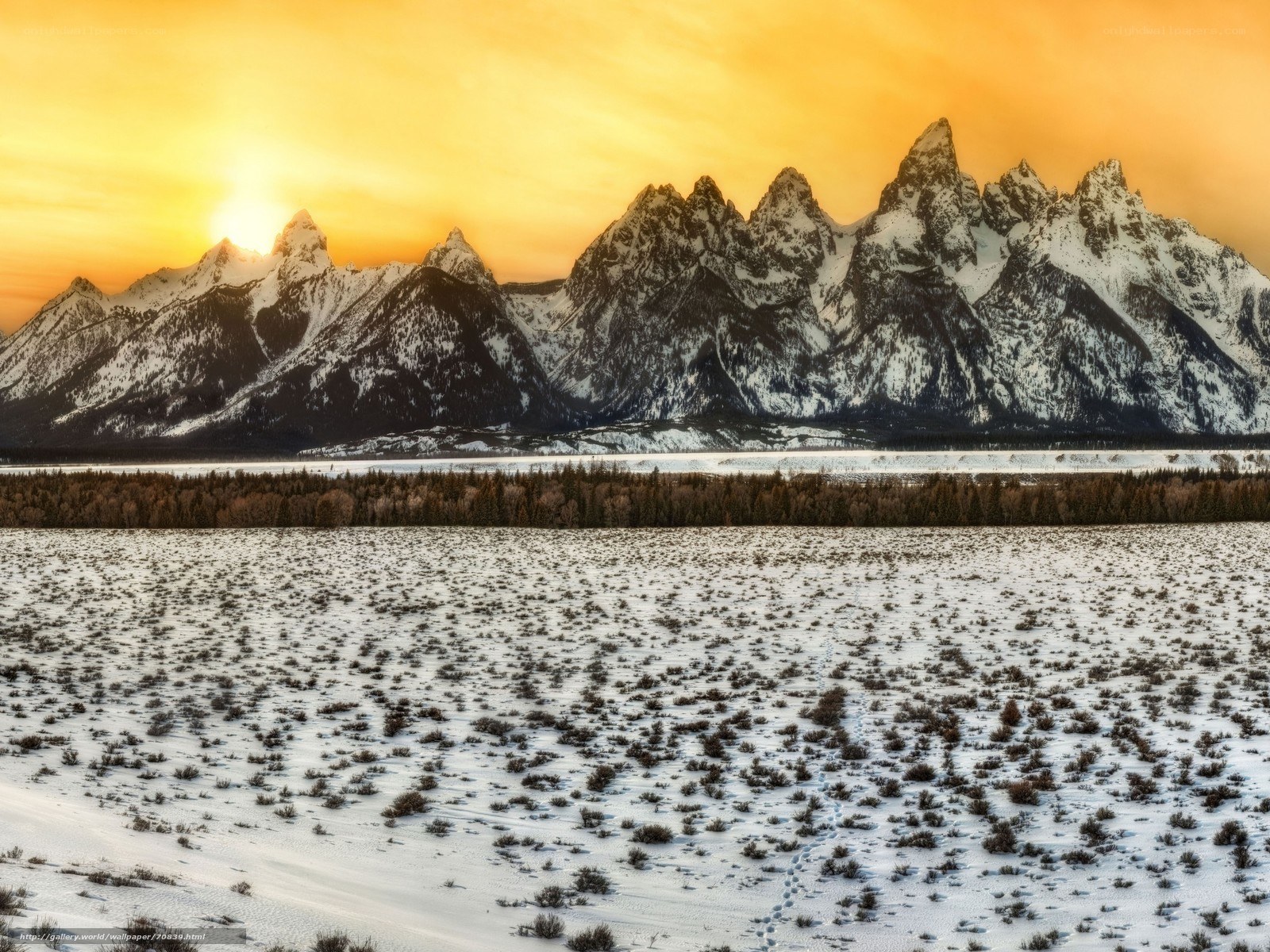 Snowy mountains at sunset