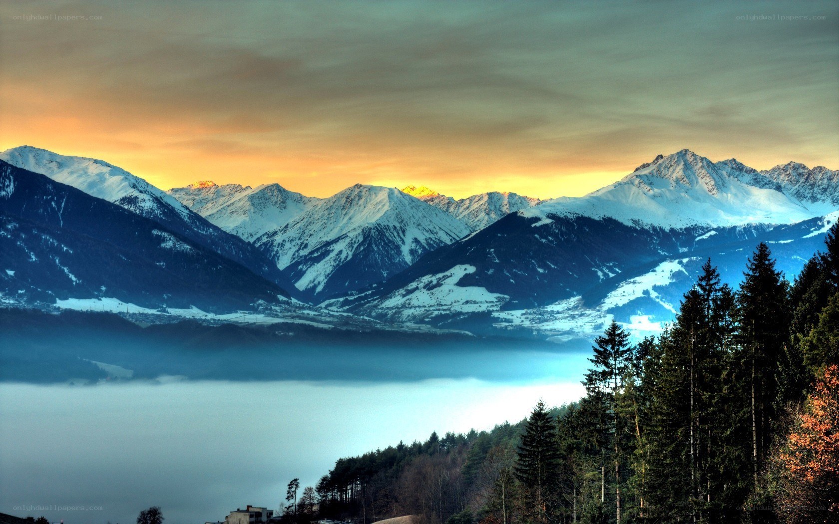 snowy mountains at sunset