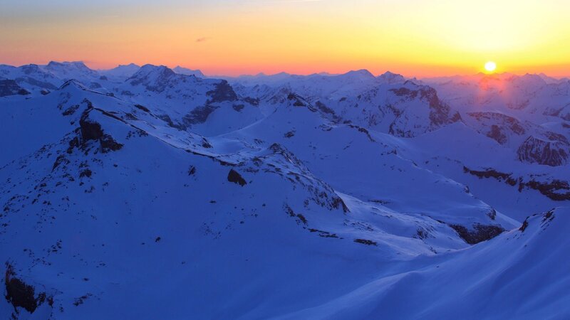 snowy mountains at sunset