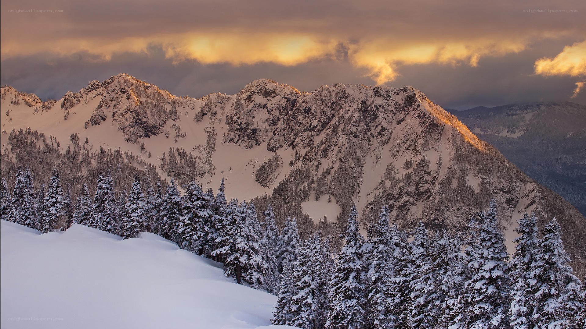 Snowy mountains at sunset