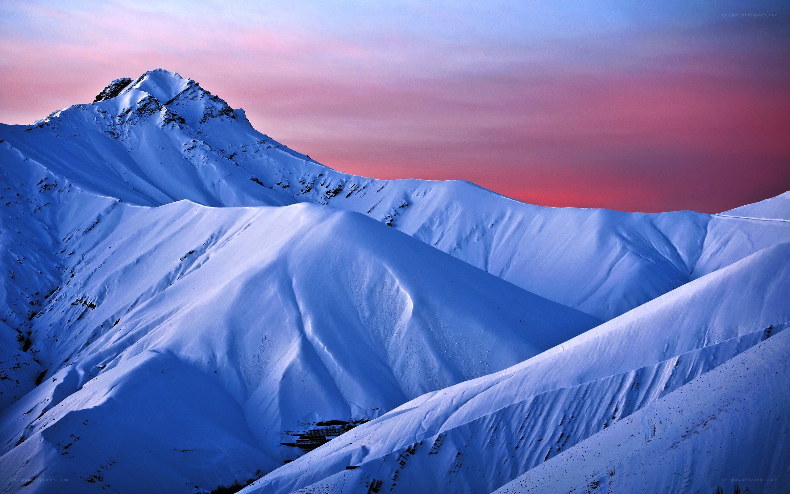 Snowy mountains at sunset