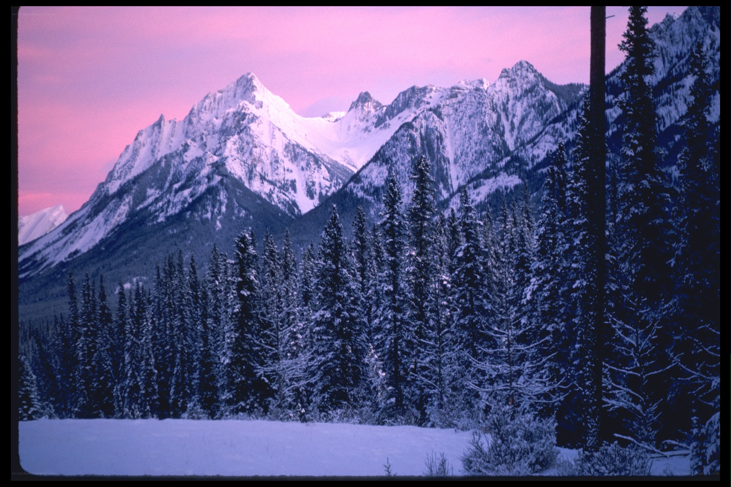 Snowy mountains at sunset