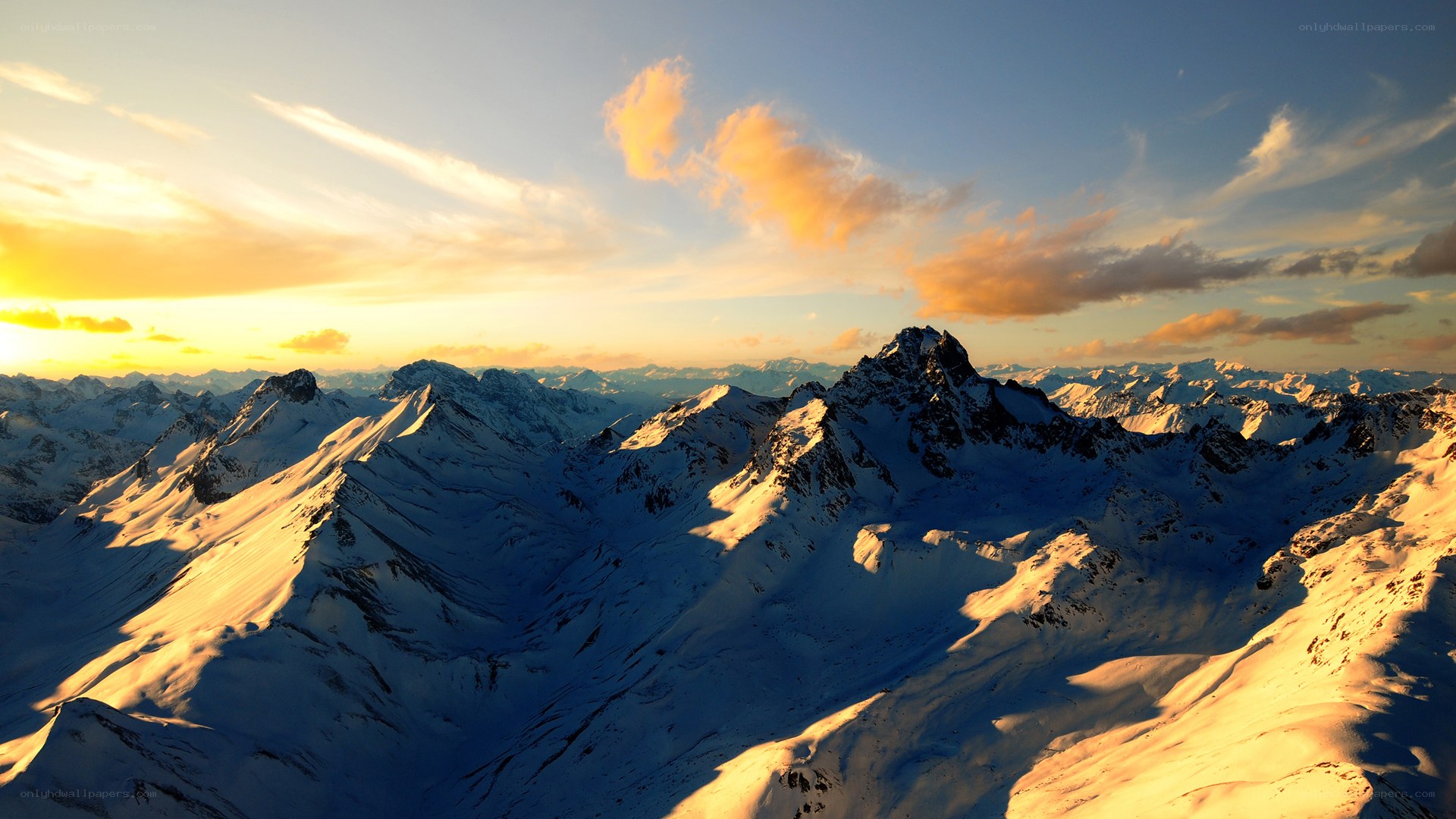 Snowy mountains at sunset