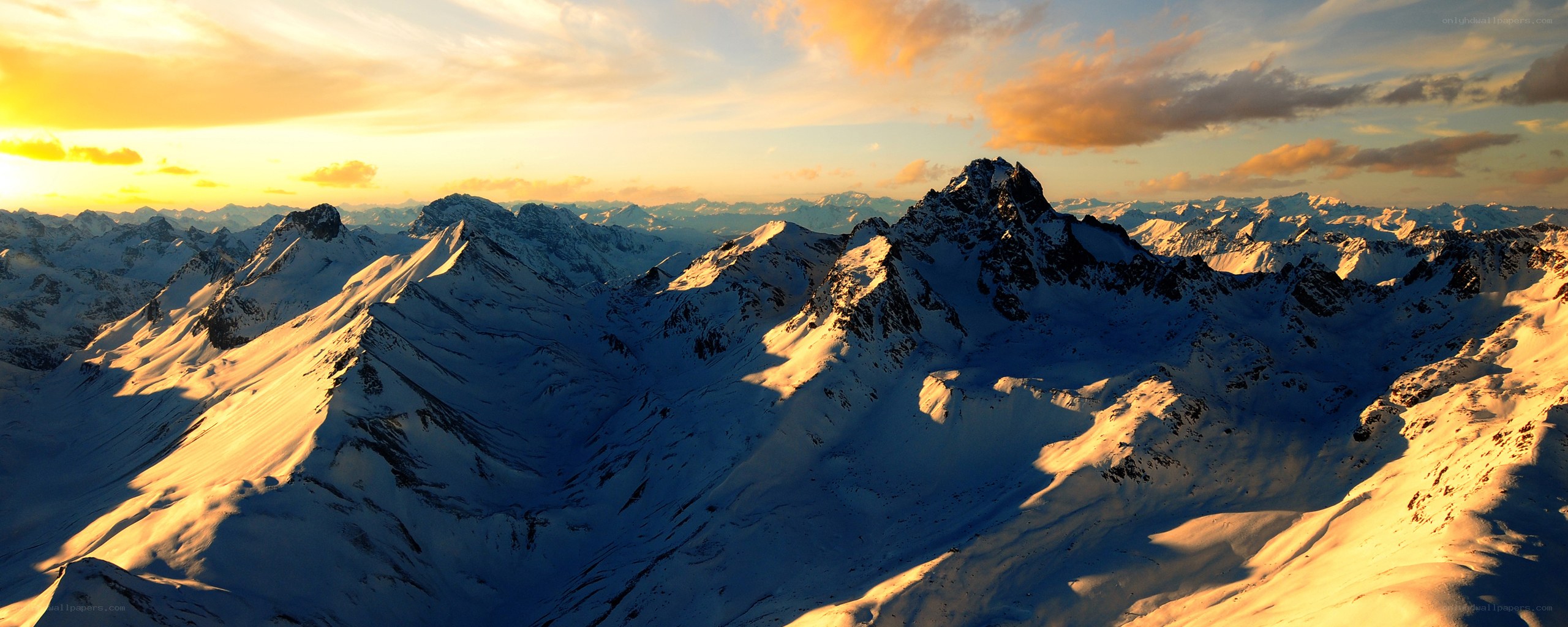 Snowy mountains at sunset