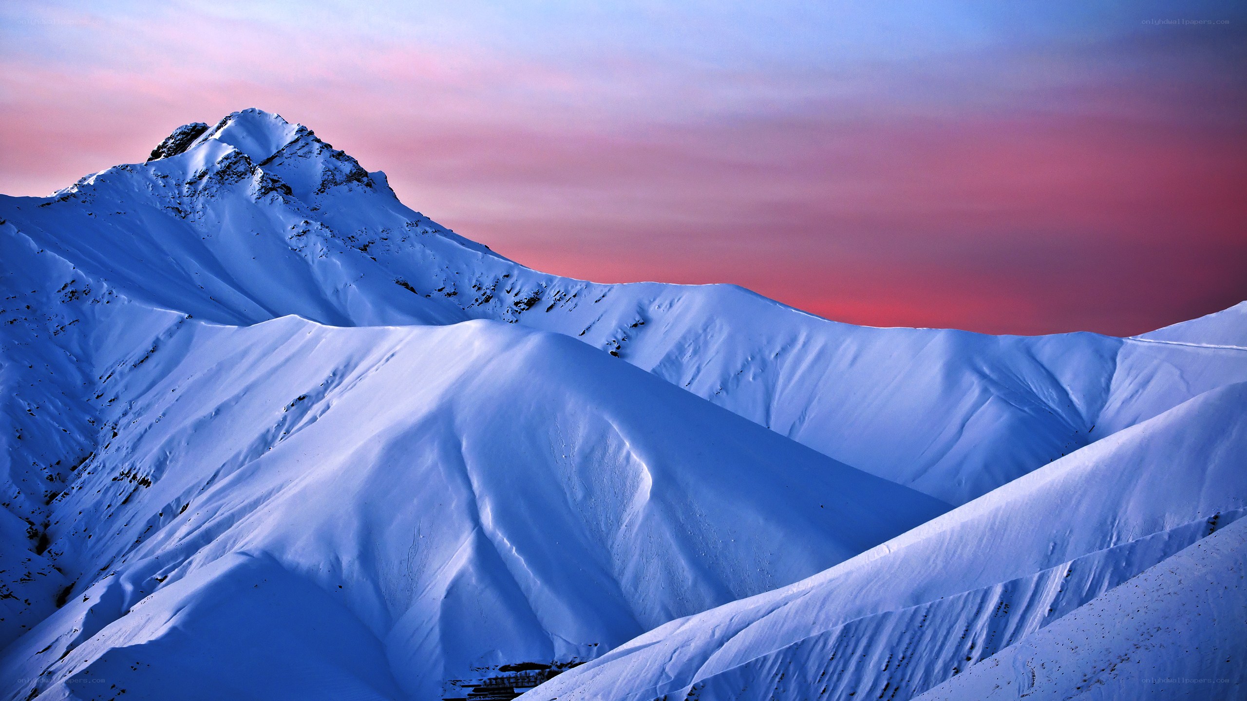 Snowy mountains at sunset