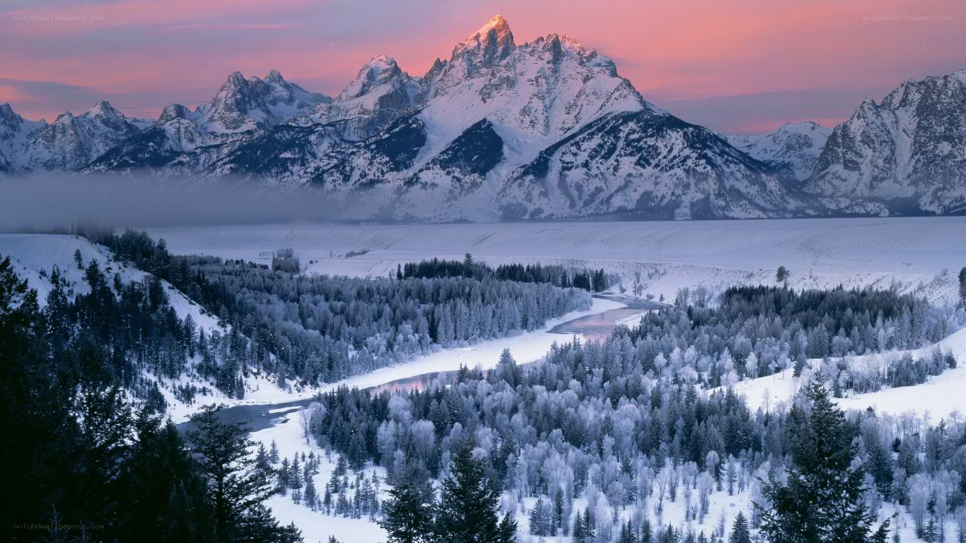 snowy mountains at sunset