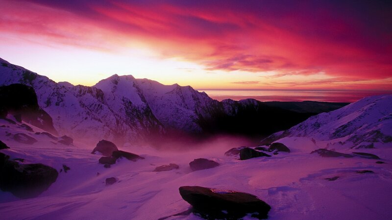 Snowy mountains at sunset
