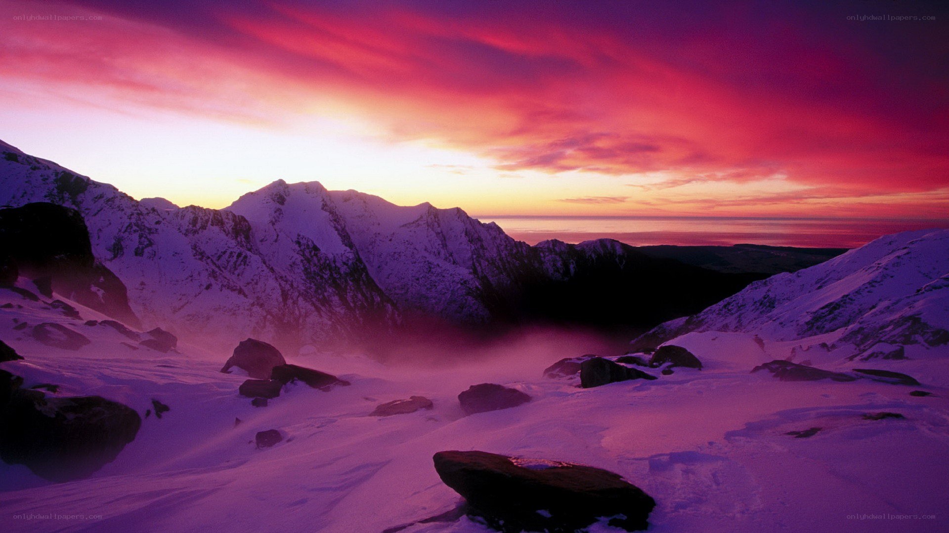 Snowy mountains at sunset